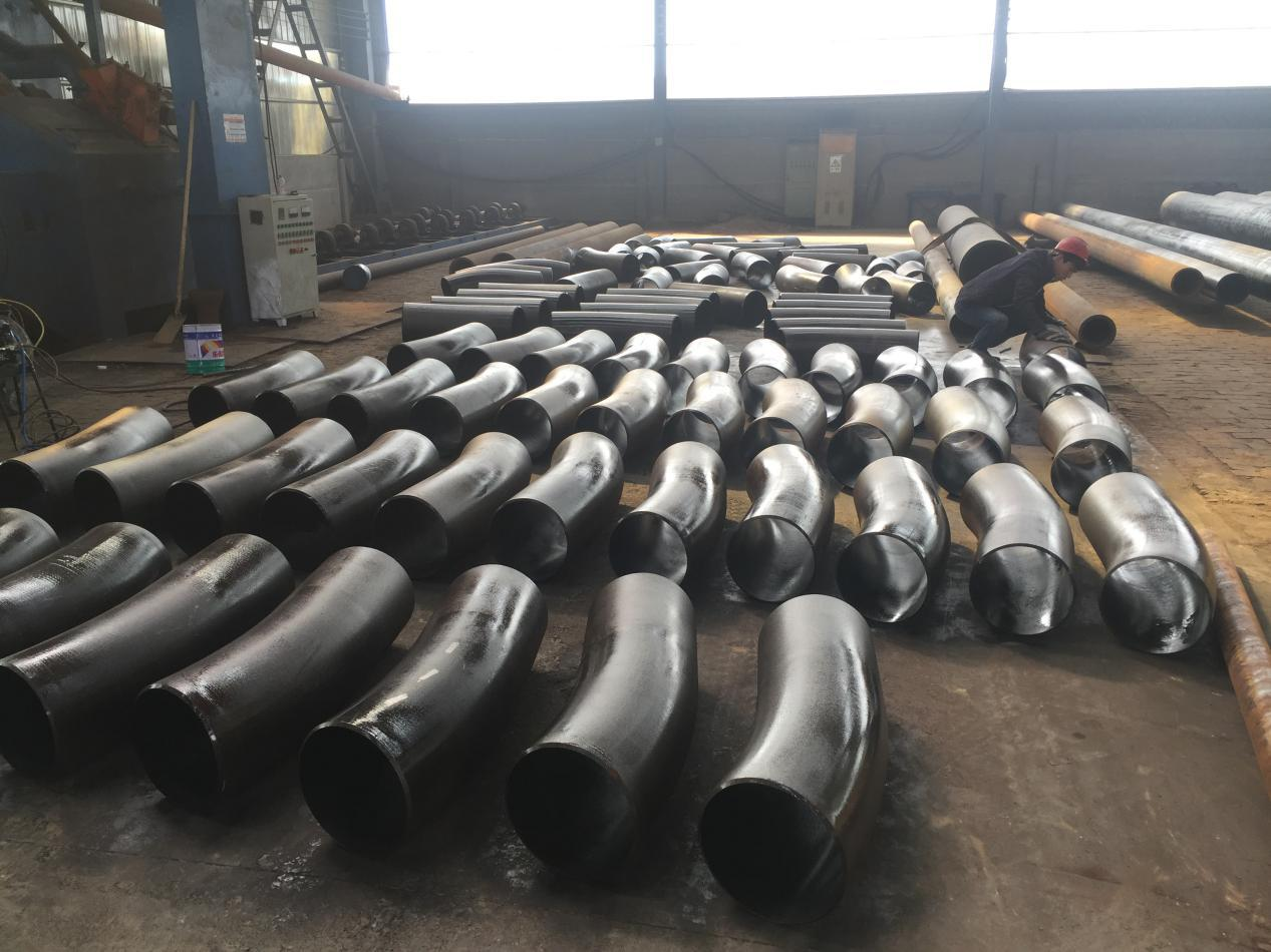 Production of pipeline steel alloy pipe fittings and application of carbon steel pipe fittings